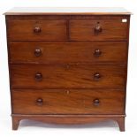 A 19TH CENTURY MAHOGANY CHEST OF TWO SHORT AND THREE LONG DRAWERS standing on splayed bracket