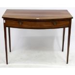 A GEORGE III MAHOGANY BOW FRONTED SIDE TABLE fitted with frieze drawer, standing on square