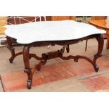 A WHITE MARBLE TOPPED CENTRE TABLE with a carved walnut base, the top 170cm x 140cm