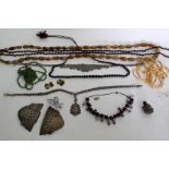 A SELECTION OF VINTAGE COSTUME JEWELLERY to include a plated belt buckle, an Eastern necklace, agate