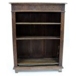 AN OAK CARVED OPEN BOOKCASE 90cm x 120cm x 34cm