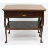 AN ANTIQUE MAHOGANY GAMES TABLE with rectangular top, pulling out to reveal a well within and with a