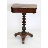 AN EARLY TO MID 19TH CENTURY WALNUT SEWING OR WORK TABLE with canted edges on a turned and carved