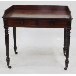 A 19TH CENTURY MAHOGANY WRITING DESK in the manner of Gillows, with a galleried back fitted with two