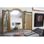 A GILTWOOD FRAMED TWO FOLD DRESSING TABLE MIRROR with an arching top, overall 110cm wide