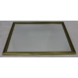 A LARGE MODERN GILT FRAMED WALL MIRROR with bevelled mirror plate, 131cm wide x 100cm high