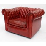 A RED LEATHER BUTTON BACK CHESTERFIELD STYLE TUB CHAIR with scrolling arms, 101cm x 76cm