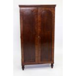 A VICTORIAN FLAME MAHOGANY DWARF CABINET fitted with two arched panel doors, standing on turned