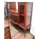 A LATE VICTORIAN MAHOGANY CABINET with twin glazed doors either side of a bow fronted single door,
