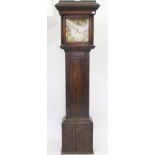 AN ANTIQUE OAK LONG CASE CLOCK the 12 inch brass dial with silvered chapter ring and subsidiary date