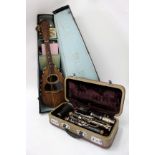 A CONSOLE STEELEBONITE CASED STUDENTS CLARINET and a mother of pearl and ebony inlaid mandolin in