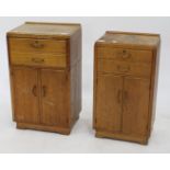 A NEAR PAIR OF OAK BEDSIDE CABINETS with single drawer and two doors, the largest 41cm wide x 68cm