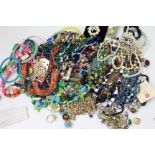 A LARGE SELECTION OF ASSORTED COSTUME JEWELLERY to include bracelets, necklaces, bangles, earring,