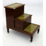 A SET OF 19TH CENTURY MAHOGANY LIBRARY STEPS with green gilt tooled leather panels, with