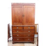 A GEORGIAN OAK LINEN PRESS the upper section with panel doors enclosing slides within, over two