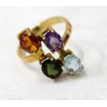 A FOUR STONE VARI-GEM SET YELLOW METAL RING stamped 750