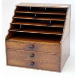 A VICTORIAN MAHOGANY DESK OR STATIONARY RACK with pigeon holes above three fitted frieze drawers,