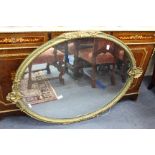 A REGENCY STYLE GILT PAINTED PIER GLASS and a 19th century gilt painted oval glass overmantle mirror