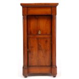 A REGENCY YEW WOOD EMPIRE STYLE BEDSIDE CABINET with single drawer above a lift up lidded recess,