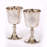 A PAIR OF ELIZABETH II SILVER GOBLETS with plain bowls, turned baluster stems and spreading circular