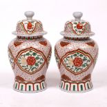 A PAIR OF CHINESE PORCELAIN BALUSTER VASES AND COVERS 57cm high