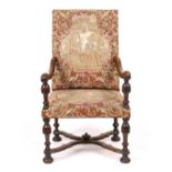 AN 18TH CENTURY WALNUT OPEN ARMCHAIR with tapestry covered back and seat, shaped arms with turned