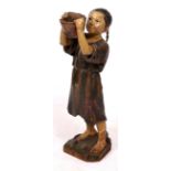 A RARE 19TH CENTURY CARED AND PAINTED SHOP FIGURE in the form of a young tea plantation picker,