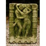 A COMPOSITION STONE CARVING OF A DANCING GIRL flanked by two pillars, 40cm x 60cm