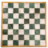 A 19TH CENTURY ONYX AND SLATE CHESS BOARD with a paper label to the reverse, J.S. Cuzner, Slate