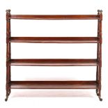 A REGENCY MAHOGANY LIBRARY BOOKCASE with four open shelves, brass ball finials, ring turned supports