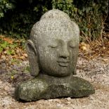 A CARVED STONE HEAD OF A BUDDA 50cm high