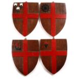 A SET OF FOUR OLD OAK CRESTS each of shield shape and centred by the Cross of St George 29cm wide