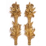 A PAIR OF ITALIAN CARVED WOOD AND GILT HANGING DECORATIONS in the form of ribbon tied acanthus