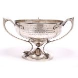 A GEORGE V ART NOUVEAU SILVER TROPHY CUP the bowl supported by three shaped handles with bird's head