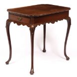 A GEORGE II RED WALNUT RECTANGULAR CENTRE TABLE the rectangular dish top with re-entrant corners,