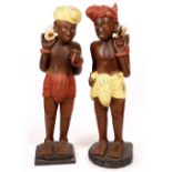 A PAIR OF LATE 19TH / EARLY 20TH CENTURY EASTERN PAINTED HARDWOOD FIGURES each with a turban and a