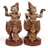 A PAIR OF 20TH CENTURY CARVED AND POLYCHROME PAINTED DEITY FIGURES 56cm high (2)