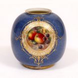 A ROYAL WORCESTER OVOID VASE with cartouche of hand painted fruit, indistinctly signed with gilt