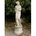 A CAST RECONSTITUTED STONE SCULPTURE of Venus, standing on a cylindrical plinth, 151cm high