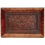 A 17TH CENTURY RELIEF CARVED OAK PANEL depicting The Nativity, set within a later frame, the panel