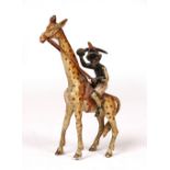 A LATE 19TH CENTURY COLD PAINTED BRONZE MODEL of a boy holding a sword, riding a giraffe, unmarked