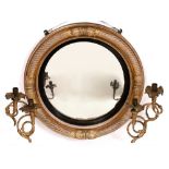 A REGENCY CIRCULAR GILT FRAMED CONVEX GIRANDOLE WALL MIRROR with cable twist decoration to the frame