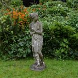 A RECONSTITUTED STONE SCULPTURE of a bathing Venus, 94cm high