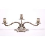 AN ITALIAN WHITE METAL TWO BRANCH THREE LIGHT CANDELABRUM with acanthus leaf decoration and