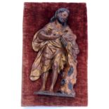 AN EARLY 18TH CENTURY CARVED GILTWOOD FIGURE possibly of St Peter, standing holding a lamb and a