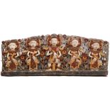 A LARGE HAND CARVED WALL PANEL depicting Indonesian figures or deities with polychrome painted