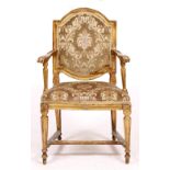 A LATE 18TH CENTURY ITALIAN CARVED GILTWOOD OPEN ARMCHAIR with arching top, scroll terminals to