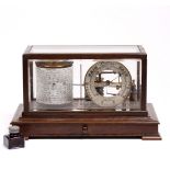 A NEGRETTI & ZAMBRA BAROGRAPH in oak case, fitted with single drawer containing charts, 36cm x