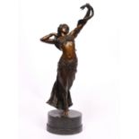 A COLD PAINTED BRONZE OF A SNAKE DANCER after Franz Bergman, the sculpture mounted on a