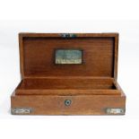 A SILVER MOUNTED MAHOGANY HUMIDOR OR CIGAR BOX with monogram applied to the top and a first plaque